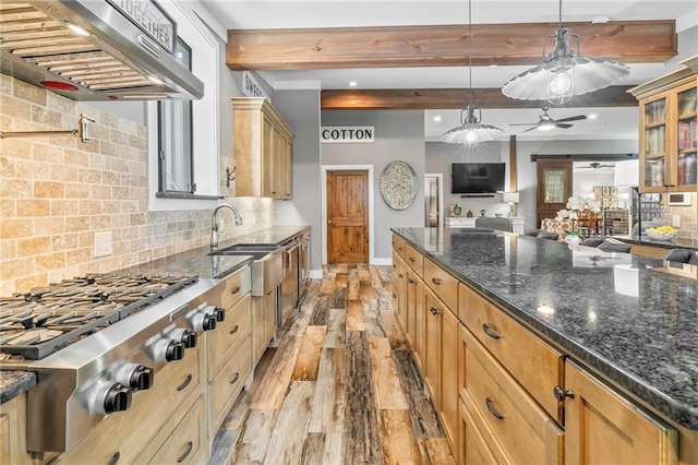 18064 Faller Rd, Tickfaw, LA 70466 - kitchen with range hood, stainless steel gas cooktop, beamed ceiling, tasteful backsplash, and glass insert cabinets