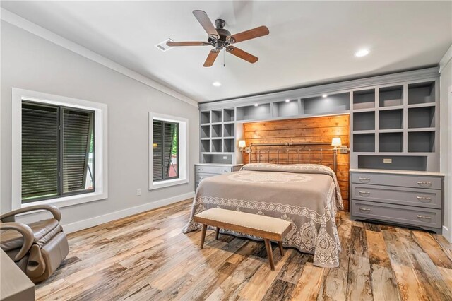 18064 Faller Rd, Tickfaw, LA 70466 - bedroom featuring wood finished floors, baseboards, crown molding, recessed lighting, and a ceiling fan