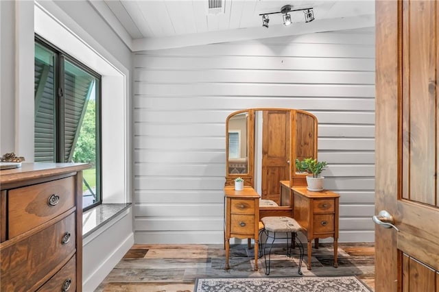 18064 Faller Rd, Tickfaw, LA 70466 - home office with wood finished floors, healthy amount of natural light, and wooden walls