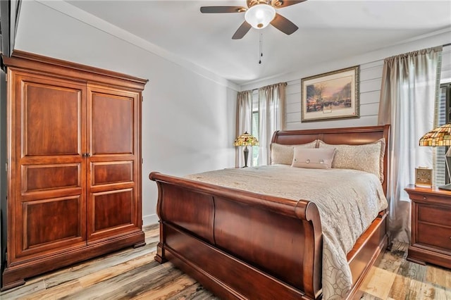 18064 Faller Rd, Tickfaw, LA 70466 - bedroom with light wood-type flooring and ceiling fan
