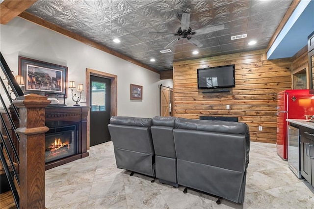 18064 Faller Rd, Tickfaw, LA 70466 - living area featuring an ornate ceiling, recessed lighting, a ceiling fan, a glass covered fireplace, and beverage cooler