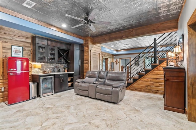 18064 Faller Rd, Tickfaw, LA 70466 - living area with beverage cooler, bar area, an ornate ceiling, stairway, and ceiling fan