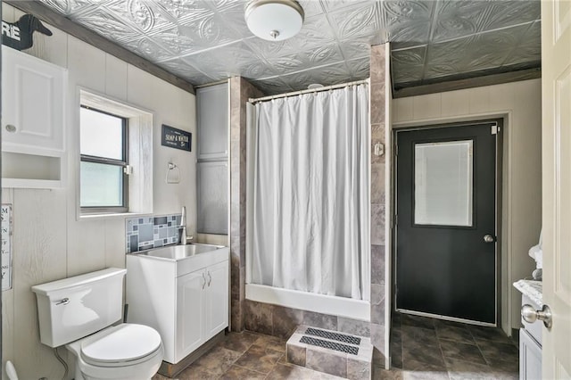 18064 Faller Rd, Tickfaw, LA 70466 - bathroom with vanity, a shower with shower curtain, toilet, an ornate ceiling, and stone finish flooring