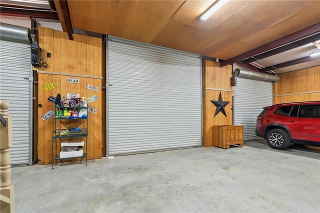 18064 Faller Rd, Tickfaw, LA 70466 - garage featuring wooden walls