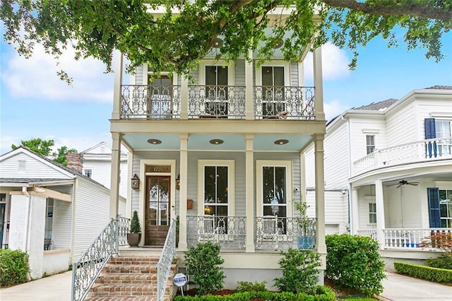 1026 Valence St, New Orleans, LA 70115 - view of front of property with a balcony, covered porch, and a ceiling fan