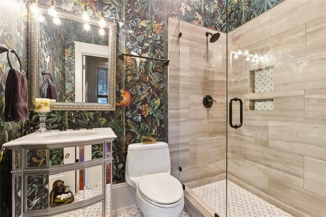 1026 Valence St, New Orleans, LA 70115 - bathroom featuring wallpapered walls, a stall shower, a sink, and toilet