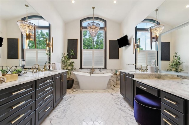 1026 Valence St, New Orleans, LA 70115 - full bath with a chandelier, plenty of natural light, vanity, vaulted ceiling, and wainscoting