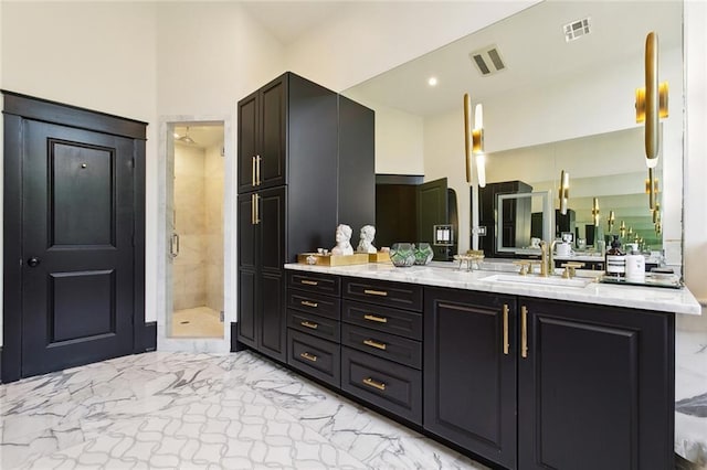 1026 Valence St, New Orleans, LA 70115 - bathroom with vanity, marble finish floors, and a shower stall