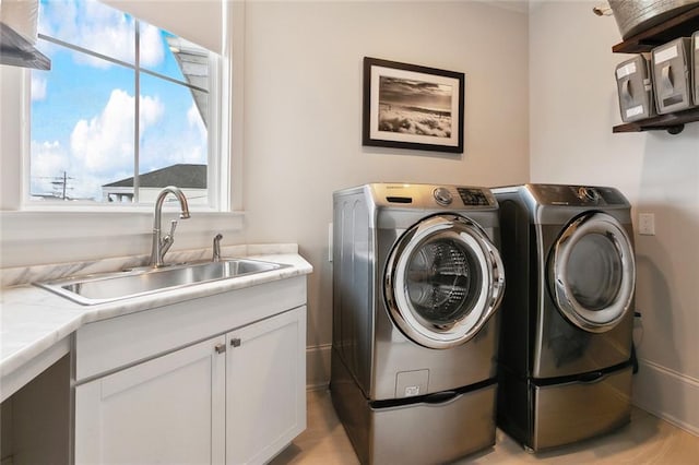 1026 Valence St, New Orleans, LA 70115 - laundry area featuring cabinet space and washing machine and dryer