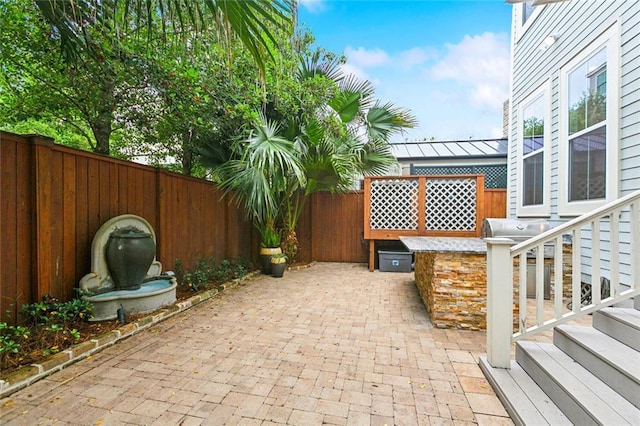 1026 Valence St, New Orleans, LA 70115 - fenced backyard featuring a patio