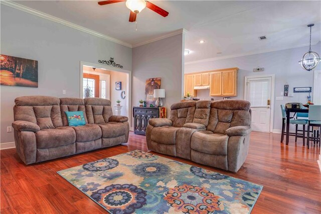 52 Hickory Dr, Covington, LA 70433 - living room featuring ceiling fan, crown molding, wood finished floors, baseboards, and a chandelier