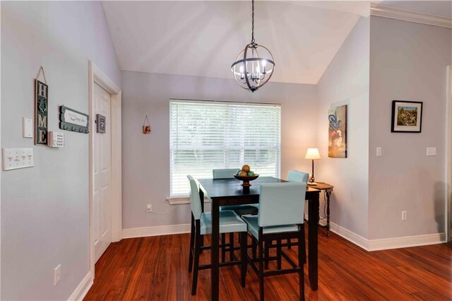 52 Hickory Dr, Covington, LA 70433 - dining space with lofted ceiling, a chandelier, dark wood-type flooring, and baseboards