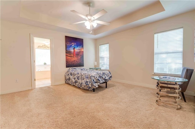 52 Hickory Dr, Covington, LA 70433 - bedroom featuring a raised ceiling, carpet flooring, baseboards, and connected bathroom