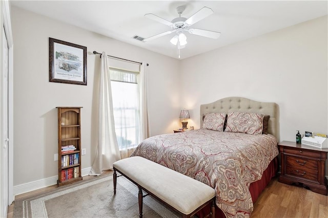 810 Still Ct, Madisonville, LA 70447 - bedroom with light wood finished floors, baseboards, and a ceiling fan