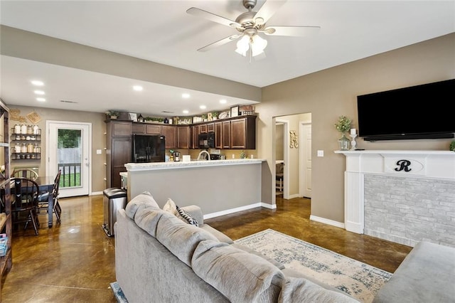 258 S Park Cir, Ponchatoula, LA 70454 - living room featuring concrete floors, a ceiling fan, baseboards, and recessed lighting