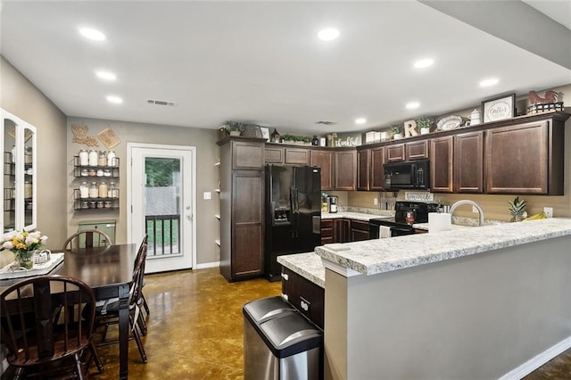 258 S Park Cir, Ponchatoula, LA 70454 - kitchen featuring black appliances, dark brown cabinetry, a peninsula, concrete floors, and recessed lighting