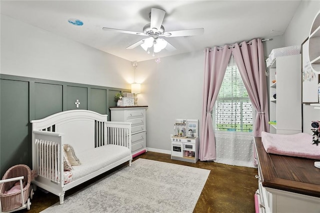 258 S Park Cir, Ponchatoula, LA 70454 - bedroom with finished concrete flooring, a decorative wall, and ceiling fan