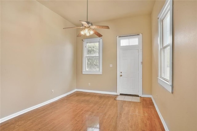 3337 Saint Ann St, New Orleans, LA 70119 - foyer entrance with light wood-style flooring, a ceiling fan, and baseboards