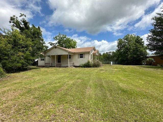 44373 Elmer Magee Rd, Franklinton, LA 70438 - rear view of property featuring a lawn and covered porch