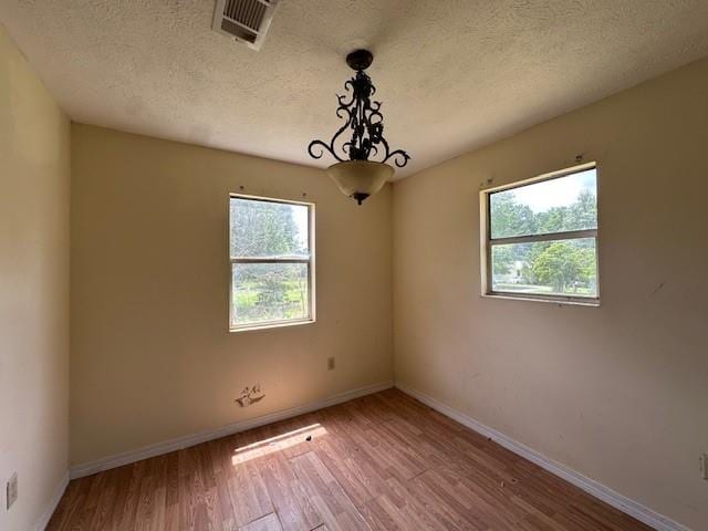 44373 Elmer Magee Rd, Franklinton, LA 70438 - spare room with wood finished floors, baseboards, and a textured ceiling