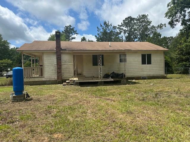 44373 Elmer Magee Rd, Franklinton, LA 70438 - rear view of house featuring a chimney and crawl space