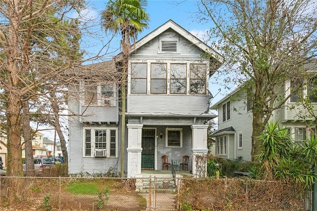 2239 General Taylor St, New Orleans, LA 70115 - view of front facade with a fenced front yard, a porch, and a gate