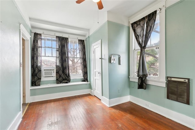 2239 General Taylor St, New Orleans, LA 70115 - spare room with heating unit, hardwood / wood-style floors, a ceiling fan, and cooling unit