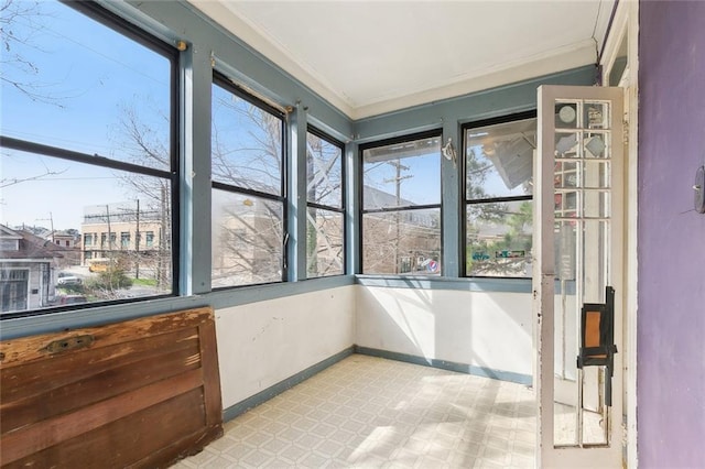 2239 General Taylor St, New Orleans, LA 70115 - unfurnished sunroom featuring tile patterned floors and ornamental molding