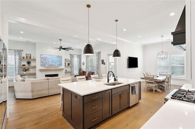 121 Chateau Papillon Ln, Mandeville, LA 70471 - kitchen with a sink, stainless steel dishwasher, light countertops, recessed lighting, and a ceiling fan