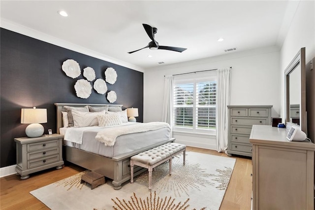 121 Chateau Papillon Ln, Mandeville, LA 70471 - bedroom featuring light wood-type flooring, recessed lighting, a ceiling fan, baseboards, and ornamental molding