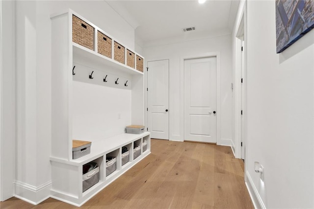 121 Chateau Papillon Ln, Mandeville, LA 70471 - mudroom featuring light wood finished floors and baseboards