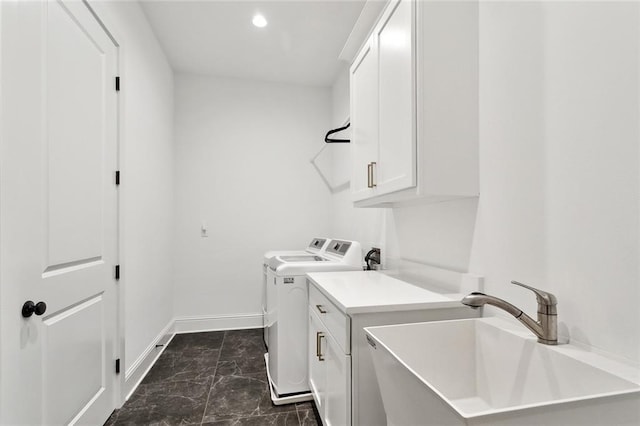 121 Chateau Papillon Ln, Mandeville, LA 70471 - washroom featuring independent washer and dryer, cabinet space, dark marble finish floors, baseboards, and recessed lighting