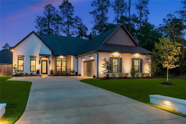 121 Chateau Papillon Ln, Mandeville, LA 70471 - view of front of house featuring concrete driveway, an attached garage, a front lawn, and a shingled roof