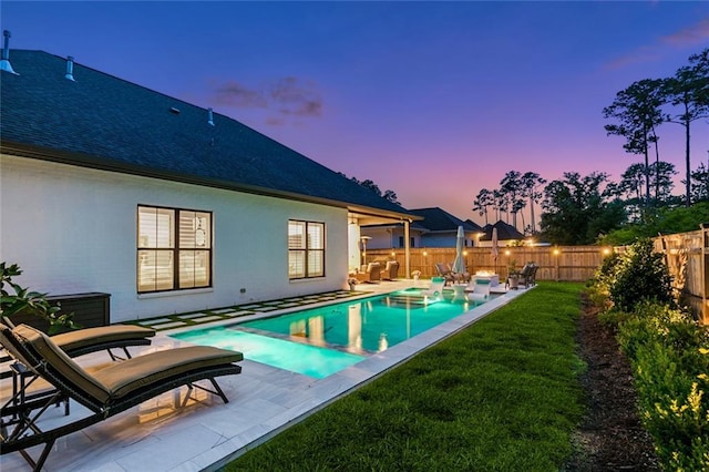 121 Chateau Papillon Ln, Mandeville, LA 70471 - pool at dusk with a patio