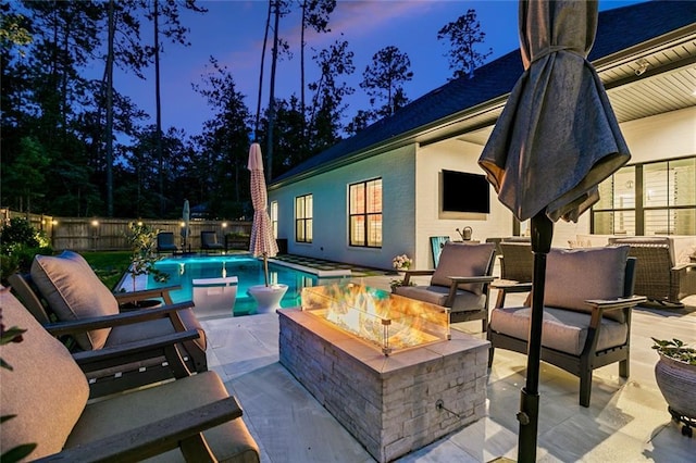 121 Chateau Papillon Ln, Mandeville, LA 70471 - fenced backyard featuring an outdoor living space with a fire pit and a patio