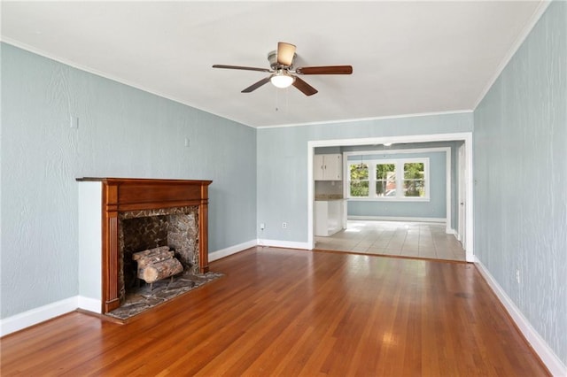 4435 Baccich St, New Orleans, LA 70122 - unfurnished living room featuring a ceiling fan, wood finished floors, ornamental molding, a high end fireplace, and baseboards