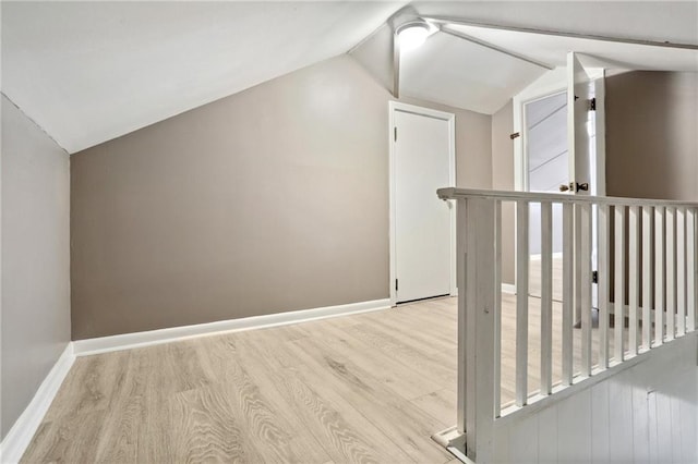 4435 Baccich St, New Orleans, LA 70122 - additional living space featuring vaulted ceiling, wood finished floors, and baseboards