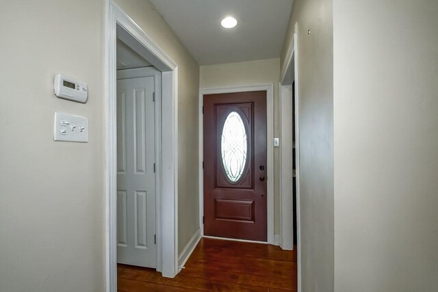 3617 Tartan Dr, Metairie, LA 70003 - doorway with dark wood-style flooring and baseboards