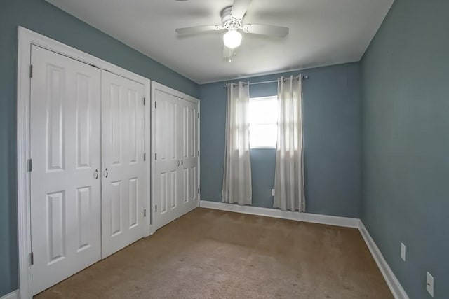 3617 Tartan Dr, Metairie, LA 70003 - unfurnished bedroom with multiple closets, carpet flooring, and ceiling fan