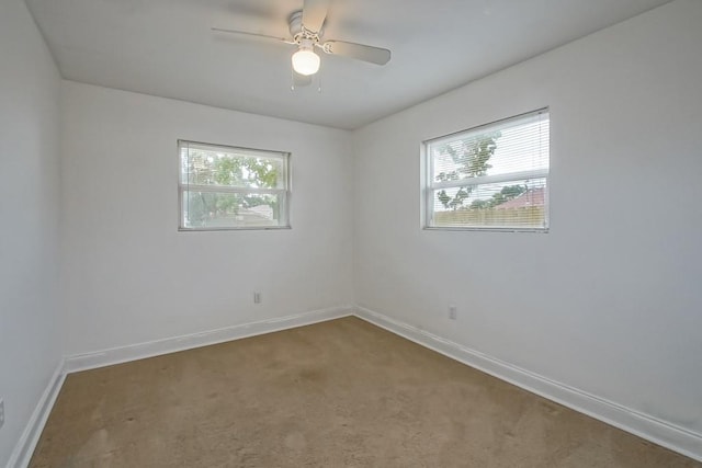 3617 Tartan Dr, Metairie, LA 70003 - carpeted empty room with plenty of natural light and a ceiling fan