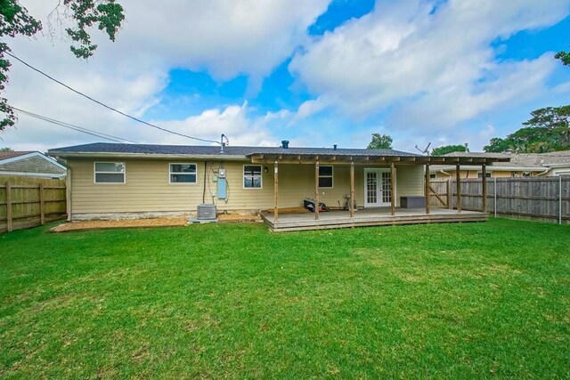 3617 Tartan Dr, Metairie, LA 70003 - back of property with french doors, a fenced backyard, and a deck