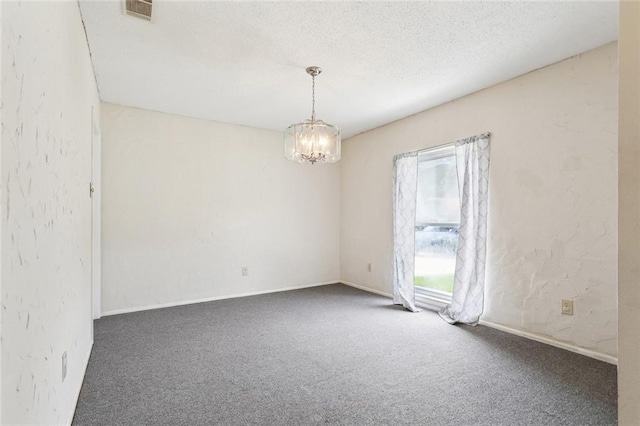 119 N Queens Dr, Slidell, LA 70458 - spare room with carpet, a chandelier, baseboards, and a textured ceiling