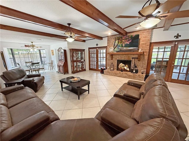 8809 Belle Grove Pl, River Ridge, LA 70123 - living room featuring ceiling fan, tile patterned floors, french doors, beam ceiling, and a fireplace
