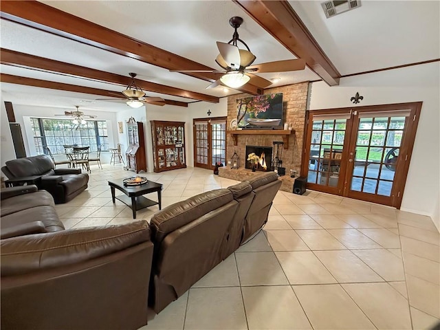 8809 Belle Grove Pl, River Ridge, LA 70123 - living area with french doors, light tile patterned floors, plenty of natural light, a ceiling fan, and beamed ceiling