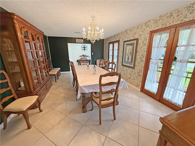 8809 Belle Grove Pl, River Ridge, LA 70123 - dining room with french doors, wallpapered walls, plenty of natural light, a chandelier, and a textured ceiling