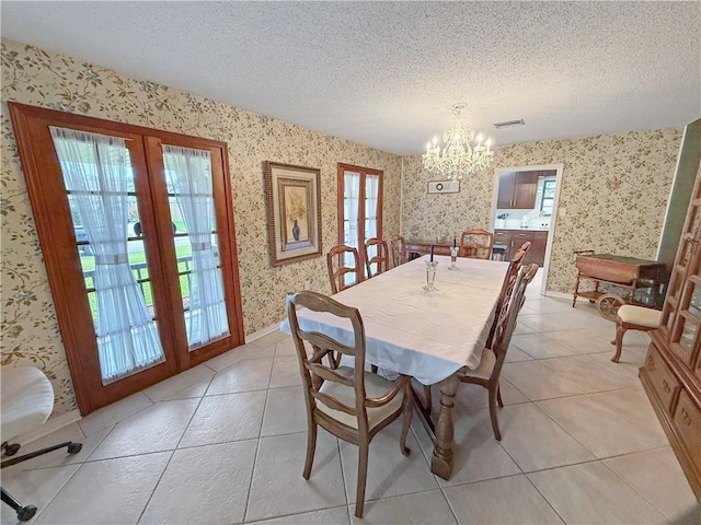 8809 Belle Grove Pl, River Ridge, LA 70123 - dining area with french doors, wallpapered walls, a chandelier, a textured ceiling, and plenty of natural light