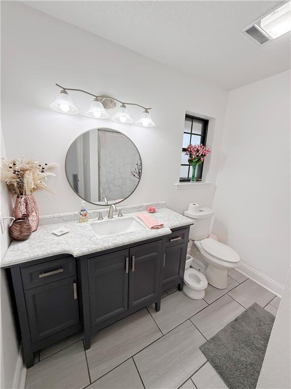 8809 Belle Grove Pl, River Ridge, LA 70123 - bathroom featuring vanity and toilet