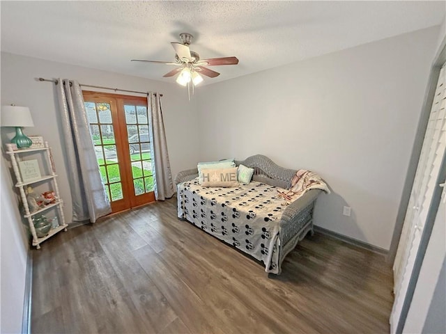 8809 Belle Grove Pl, River Ridge, LA 70123 - bedroom with wood finished floors, a ceiling fan, a textured ceiling, and baseboards