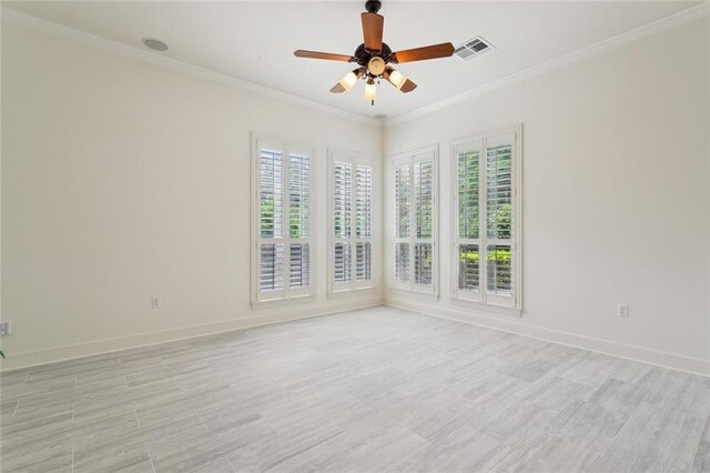 404 Southdown Loop, Covington, LA 70433 - spare room with crown molding, a ceiling fan, light wood-style flooring, and baseboards
