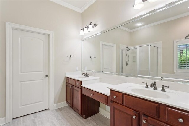 404 Southdown Loop, Covington, LA 70433 - bathroom with crown molding, double vanity, a shower stall, and baseboards